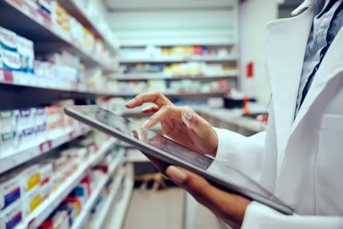 Closeup-of-hands-of-young-female-pharmacist-checking-inventory-in-medical-store-using-digital-tablet-stock-photo1-1024x683.webp