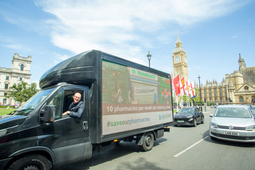 The NPA Save Our Pharmacies campaign poster van outside the Houses of Parliament