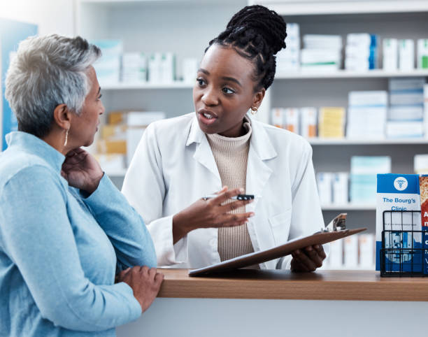 Pharmacist and patient in pharmacy consultation