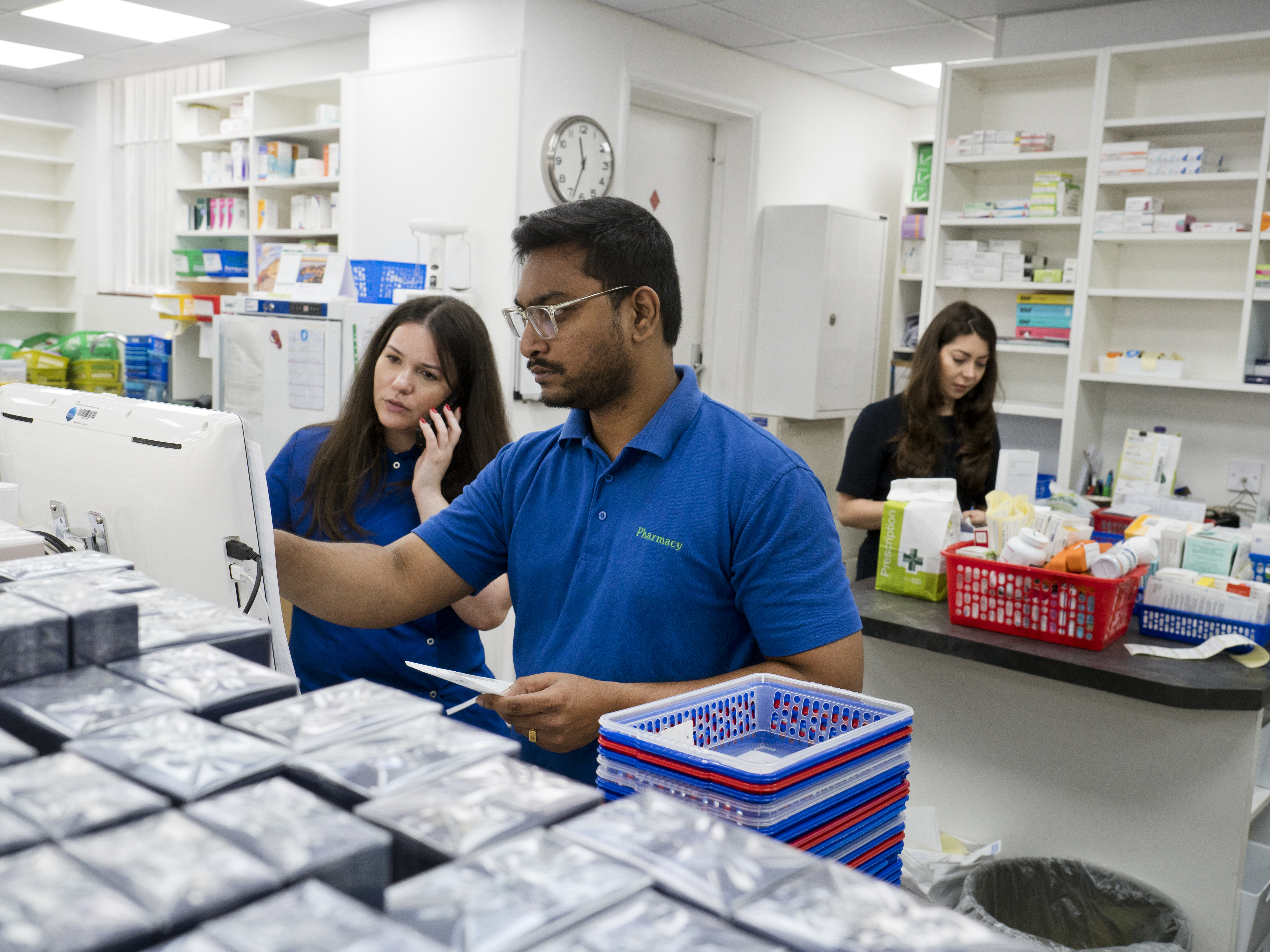 Pharmacists at computer screen
